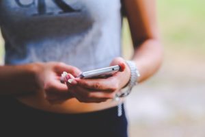 woman holding phone